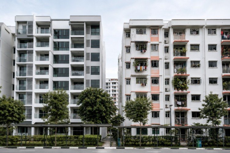 Modern and older HDB flats side by side in a Singapore neighbourhood.